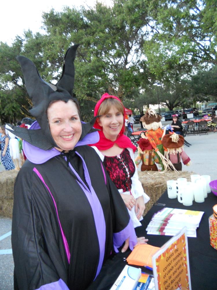 Woman dressed as Maleficent and woman dressed as Little Red Riding Hood